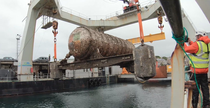 The <em>Northern Isles</em>, a 12-rack / 864-server underwater data center pod, is winched off the seafloor in this picture after its two-year trial deployment.