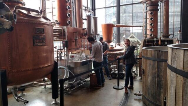 UT Department of Food Science graduate students collecting whiskey distillate samples for chemical analysis at the Sugarlands Distilling Company in Gatlinburg, Tennessee. 