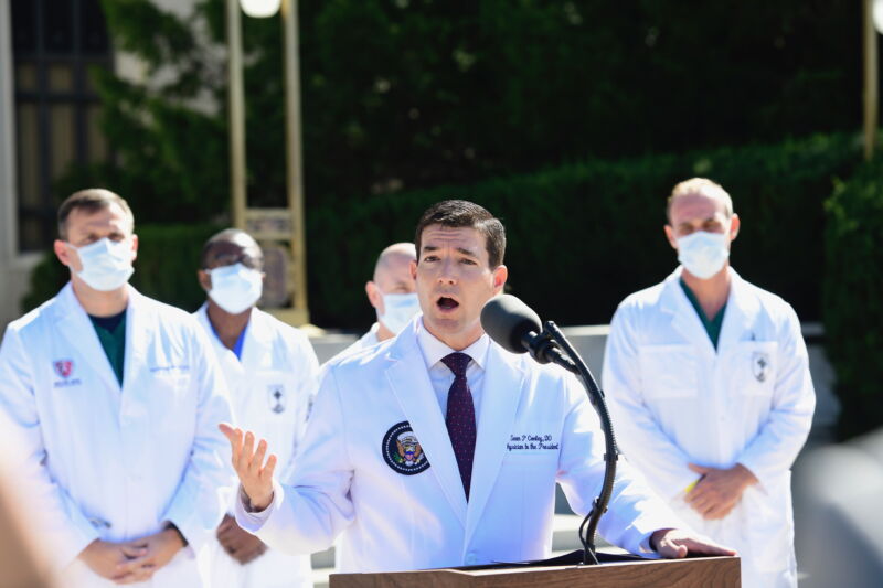 Dr. Sean Conley, White House physician, speaks during a press conference outside of Walter Reed National Military Medical Center in Bethesda, Maryland, U.S., on Saturday, Oct. 3, 2020. Dr. Conley said the president is "doing very well" and his condition is improving while being treated at the U.S. military hospital near Washington for Covid-19.