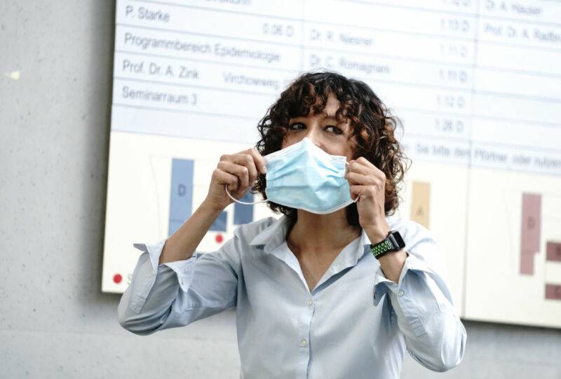 Emmanuelle Charpentier reminds everybody about pandemic safety at the start of a press conference following the announcement of her Nobel Prize.