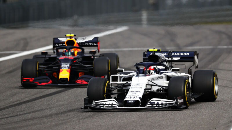 A pair of Formula 1 cars racing in close proximity