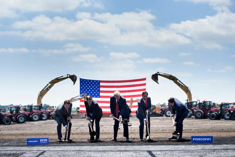 Former Wisconsin Governor Scott Walker, Donald Trump, Foxconn Chairman Terry Gou, and former House Speaker Paul Ryan participate in a groundbreaking for a Foxconn facility in Mount Pleasant, Wisconsin in 2018. Foxconn has hired significantly fewer people than it claimed it would do at the time of the company