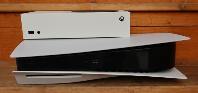 The Xbox Series S posing on top of a PlayStation 5.