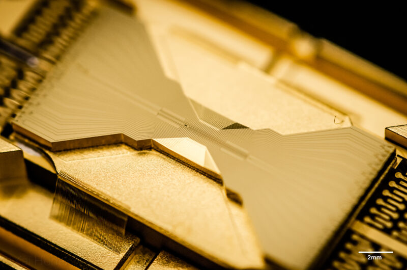 Extreme close-up photo of gold-colored computer component.