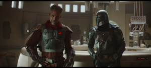 the Mandalorian speaks to townspeople
