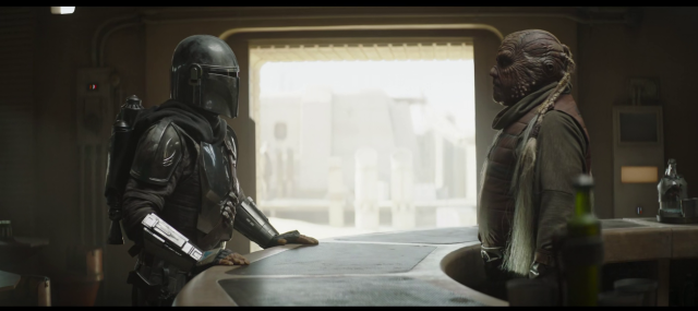 the Mandalorian speaks to a bartender