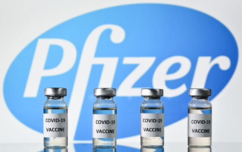 An illustration picture shows vials with COVID-19 Vaccine stickers attached, with the logo of US pharmaceutical company Pfizer, on November 17, 2020. 