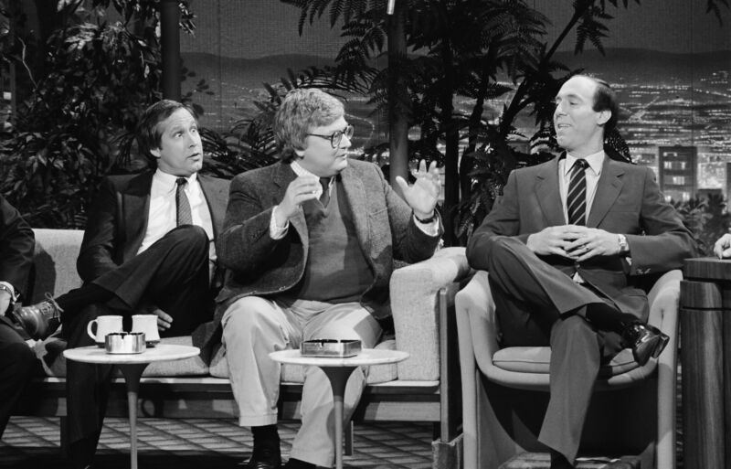 Film critics Roger Ebert (center) and Gene Siskel appear on The Tonight Show with Johnny Carson on December 12, 1986.