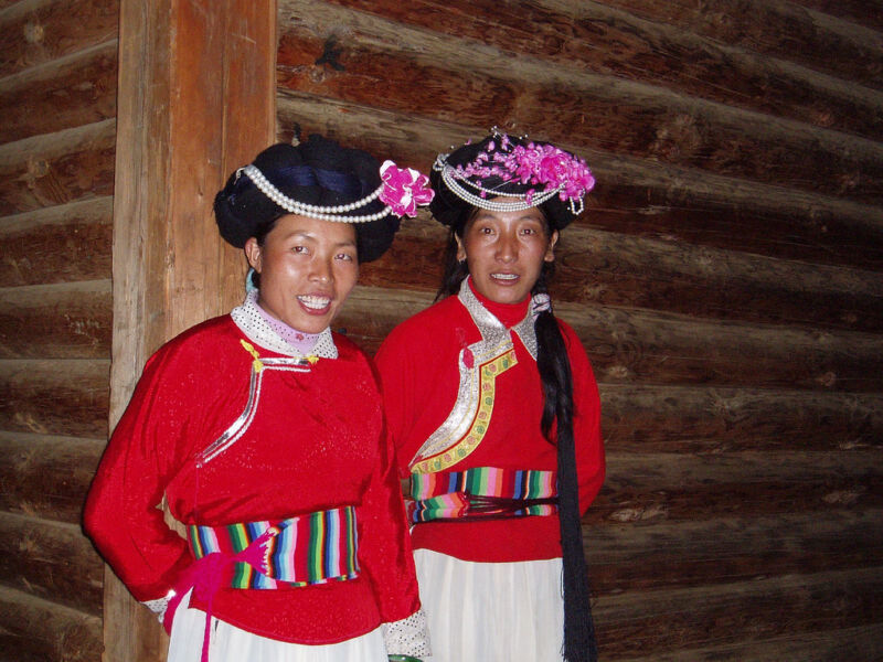 Two women in red clothing.
