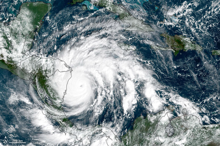 Satellite photograph of storm crossing from ocean to land.