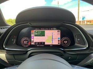 The main instrument display of an Audi R8 showing Apple CarPlay