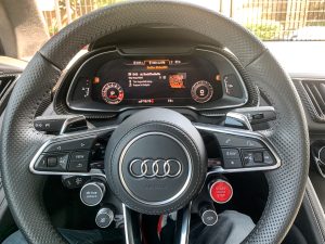 The steering wheel and main instrument display of an Audi R8