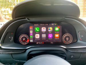The main instrument display of an Audi R8 showing Apple CarPlay