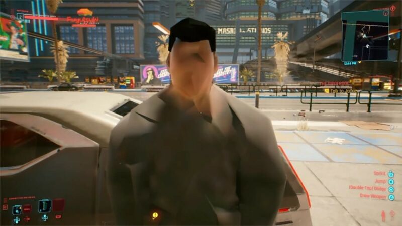 A <em>Cyberpunk</em> NPC is shown talking before his textures have fully loaded on the console version of the game.