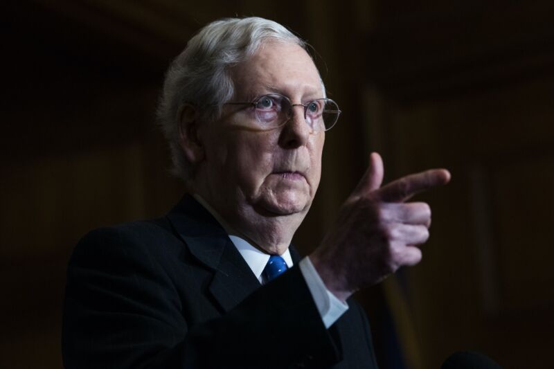 Senate Majority Leader Mitch McConnell pointing his finger at a news conference.