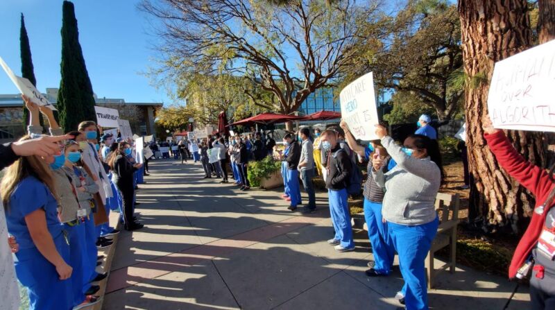 Images of people protesting while wearing medical garb.