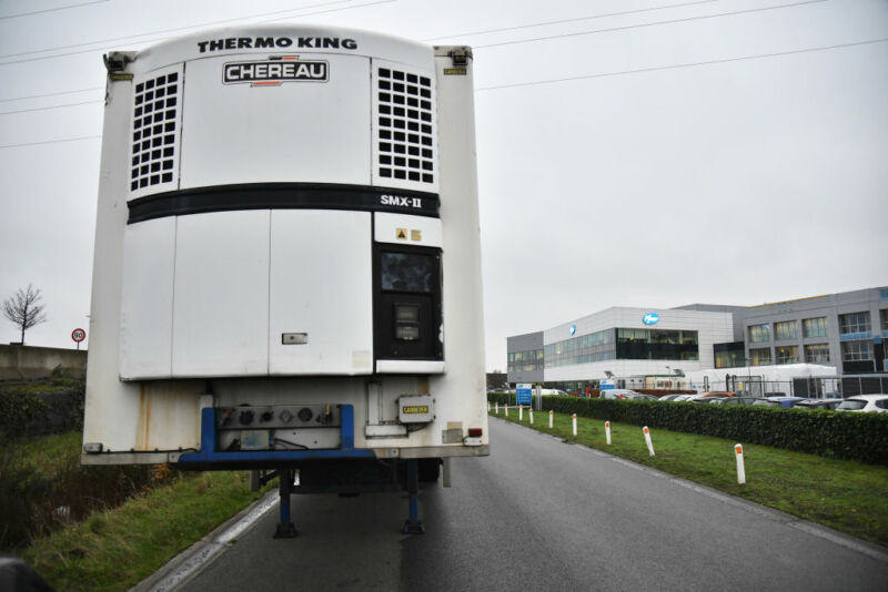 A temperature-controlled thermal transport truck trailer in front of Pfizer Inc.'s facilities in Puurs, Belgium on Thursday, December 3, 2020. 