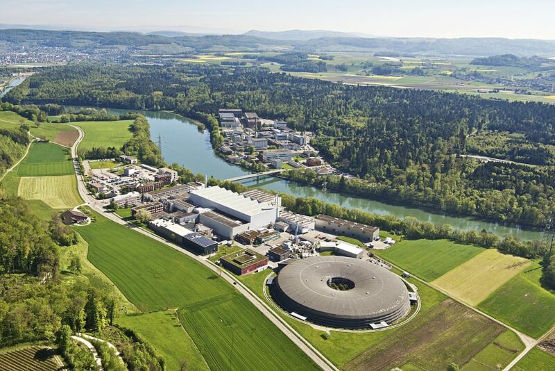 A huge pavement campus surrounded by green fields.