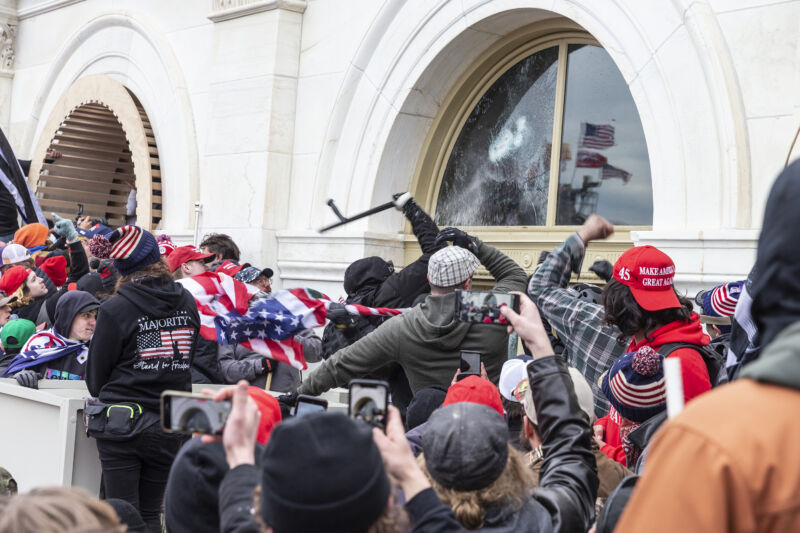 Pro-Trump protesters break windows of the Capitol building on January 6, 2021.