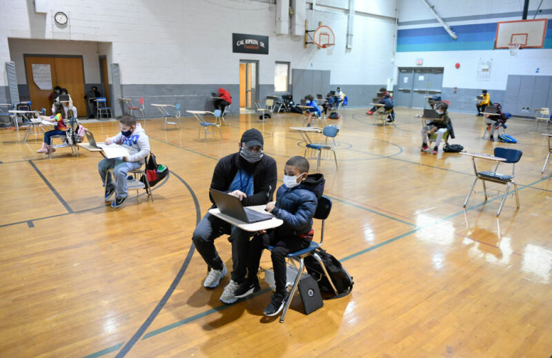 Image of a classroom with widely distributed desks.