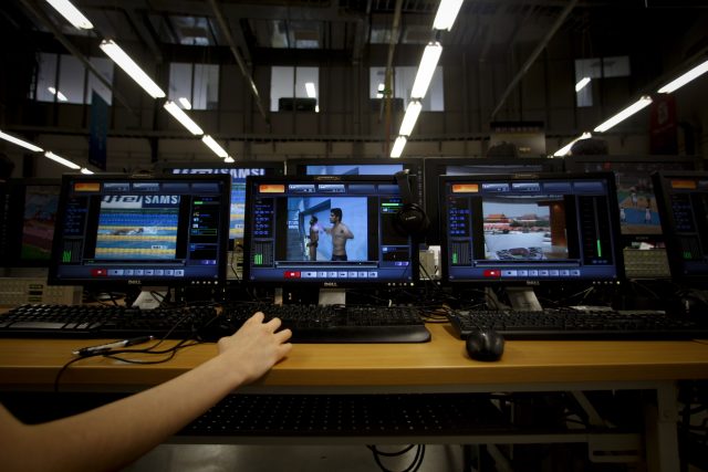 A technician works inside China Central Television's (CCTV) satellite Olympic broadcast facility for the Beijing Olympics.