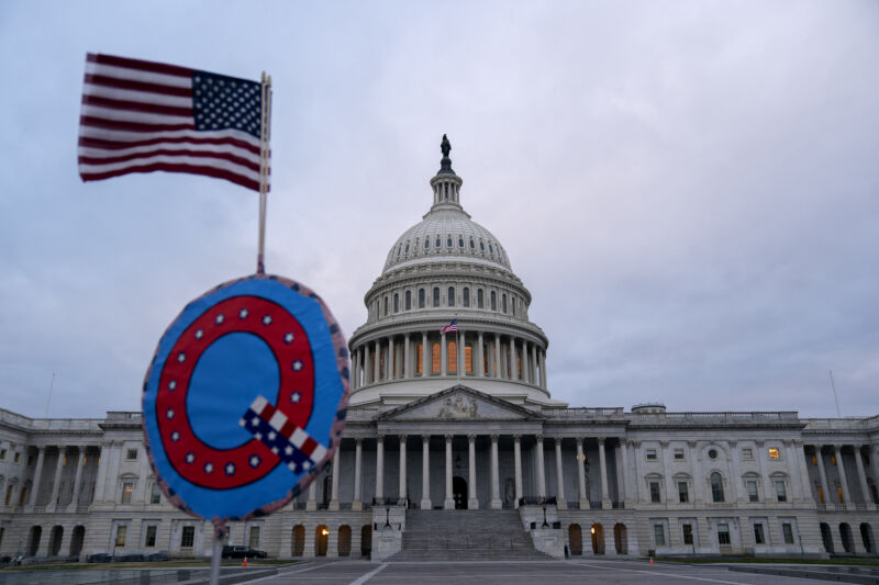 A demonstrator holds a "Q" sign outside the U.S. Capitol in Washington, D.C., U.S., on Wednesday, Jan. 6, 2021. 