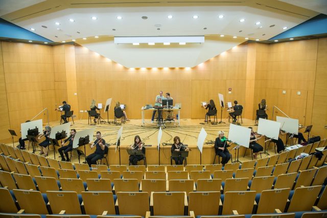 Sixteen violinists took part in a network experiment in which they were connected to a computer system, and heard only the sound of the computer.