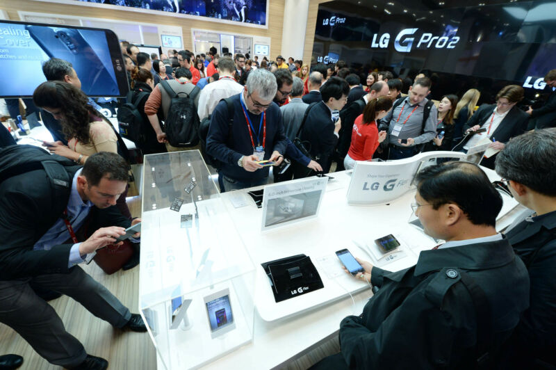 Crowds view new smartphones at a prior MWC event.