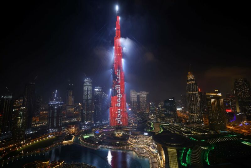 Dubai's Burj Khalifa is lit up in red with a slogan reading in Arabic, "Mission accomplished" on February 9, 2021 as the UAE's Hope probe successfully entered Mars' orbit.