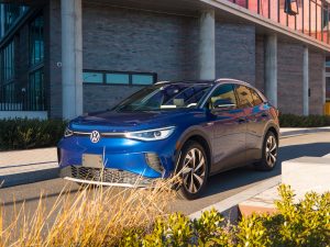 A VW ID.4 parked in front of a building