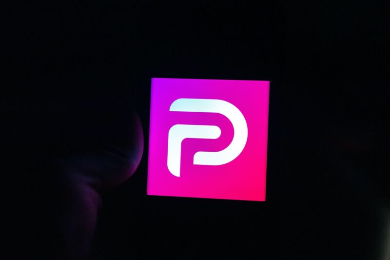 The Parler logo on a phone screen.
