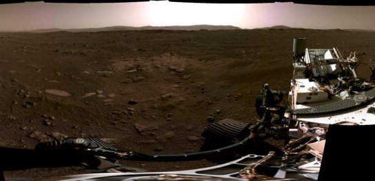 A rover's-eye view of a forbidding rocky landscape.