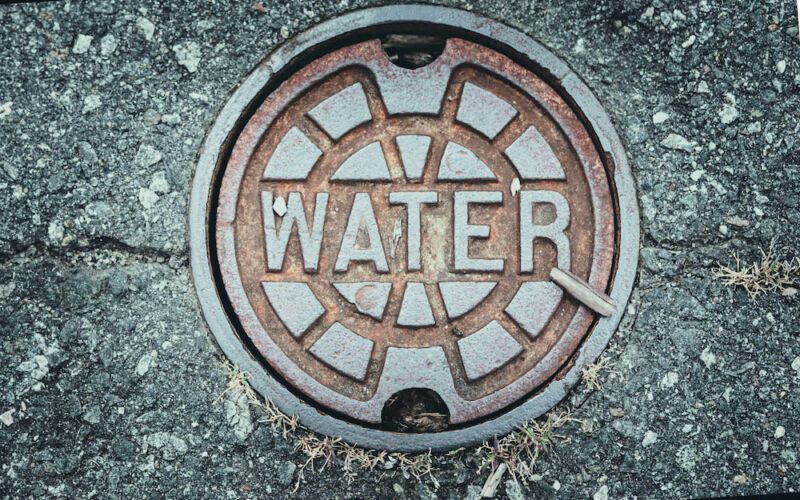Stock photo of a water main cover.