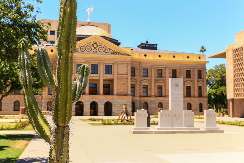 The Arizona State Capitol museum, flanked by the House of Representatives building (R) and a cactus (L). 