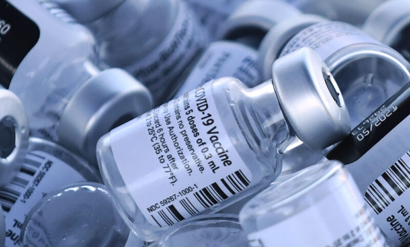 Empty vials of the Pfizer COVID-19 vaccine are seen at a first-come, first-serve drive-thru vaccination site operated by the Lake County Health Department on January 28, 2021 in Groveland, Florida. Seniors 65 and older waited in line for hours to be vaccinated. 