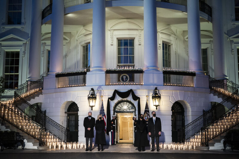 President Joe Biden, first lady Jill Biden, Vice President Kamala Harris, and second gentleman Doug Emhoff participate in a moment of silence and candle light ceremony at sundown with 500 candles for the 500,000 dead from the COVID-19 pandemic, at the South Portico at the White House on Monday, Feb. 22, 2021 in Washington, DC. 