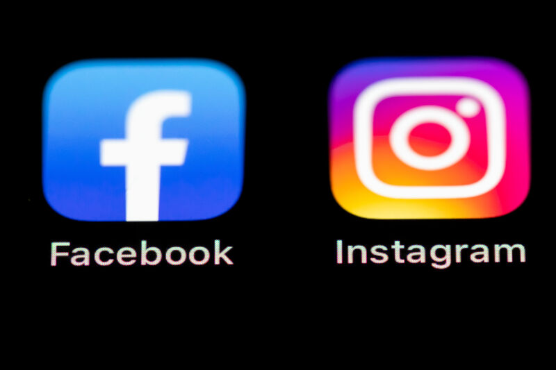 Extreme close-up image of Facebook and Instagram icons on a smartphone screen.