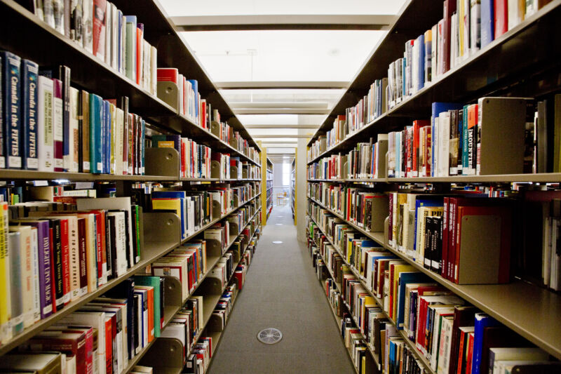 A Pair Of Full Bookshelves Face Each Other.