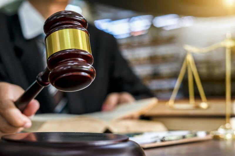 Closeup shot of a judge holding a gavel.