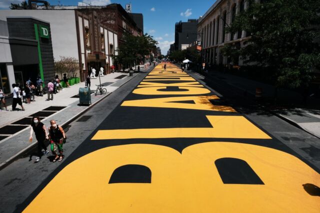 A massive painted "Black Lives Matter" phrase runs along the block of Fulton Street between Marcy and Brooklyn avenues in Brooklyn, New York.