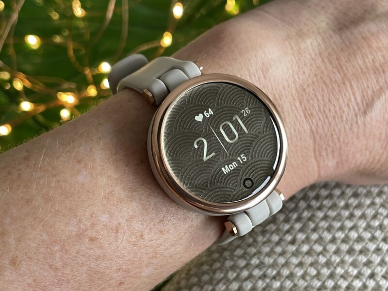 A garmin lily wearable on a woman's wrist