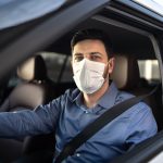 Portrait of driver wearing protective medical mask