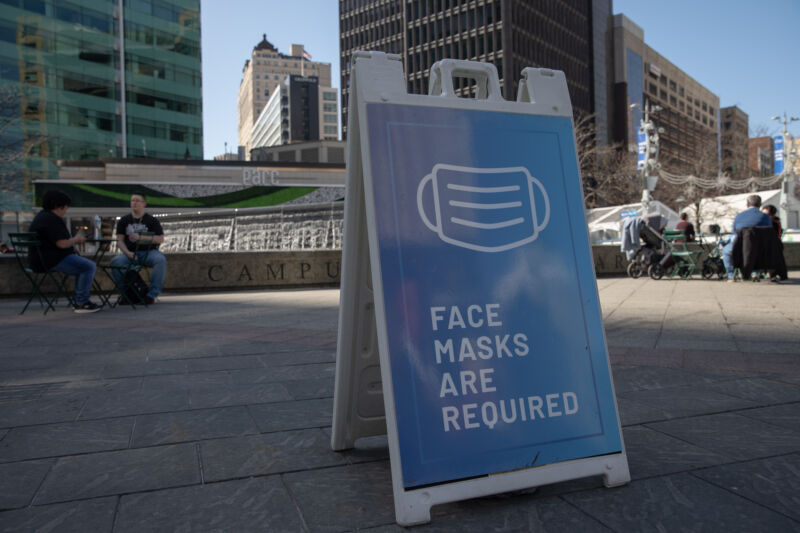 A sign requiring protective face masks in Detroit, Michigan on Sunday, March 21, 2021. 