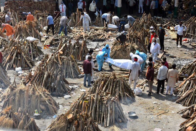 Funeral pyres of people who died of COVID-19 being prepared simultaneously at Gazipur crematorium on April 26, 2021 in New Delhi, India. 