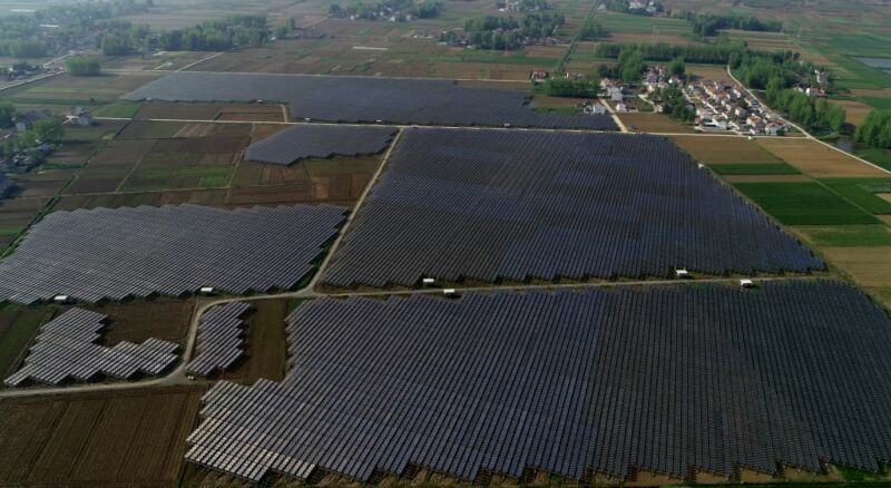 Aerial photograph of solar farms mixed with traditional farmland.