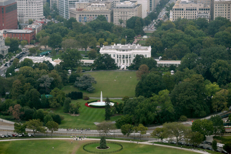 The White House, the South Lawn, and part of the Ellipse are seen from the observation deck of the Washington Monument on October 1, 2014, in Washington, DC. 