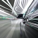 black German car drives through a modern tunnel