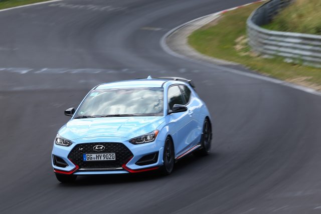 A blue Hyundai Veloster N at the Nurburging