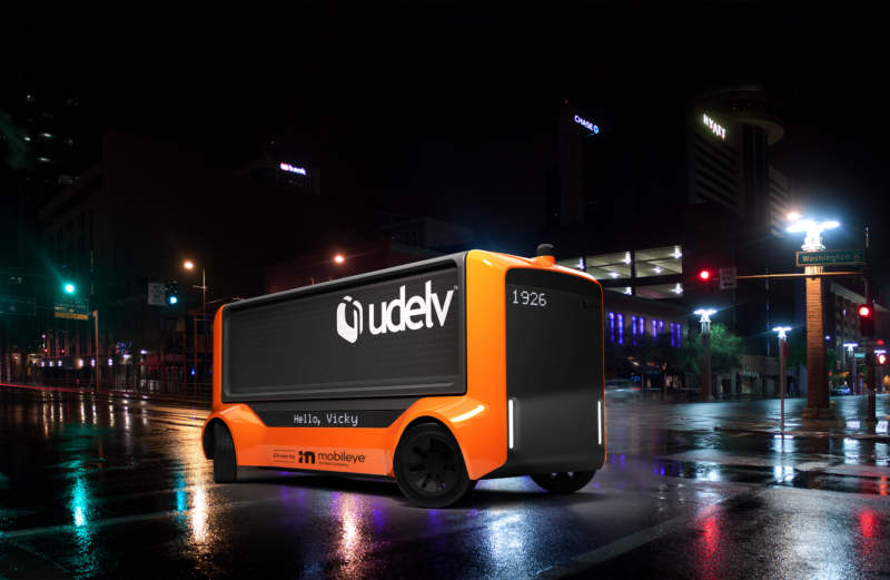 Technology A Udelv-branded van roams wet streets at night.