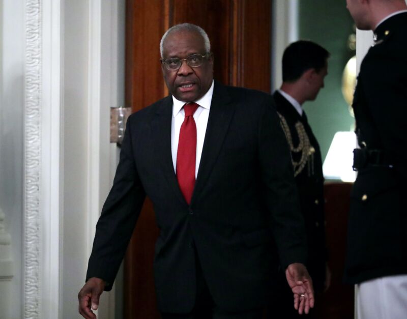 Supreme Court Justice Clarence Thomas walking through the White House.